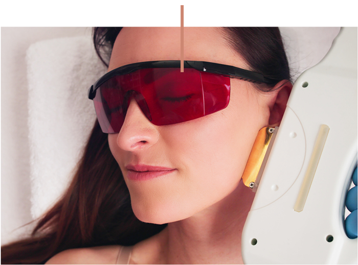 a close up of a woman wearing a hat and sunglasses