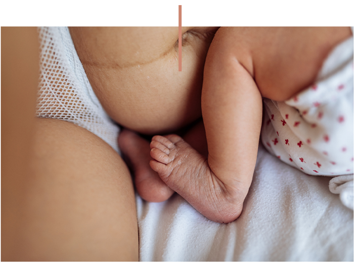 a woman sitting on a bed